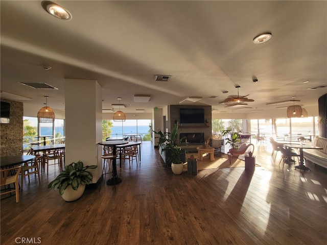 25 15th Pl Unit 101, Long Beach, CA 90802 - living area with a ceiling fan, healthy amount of natural light, and wood finished floors