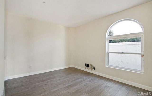 25 15th Pl Unit 101, Long Beach, CA 90802 - unfurnished room with wood finished floors and baseboards