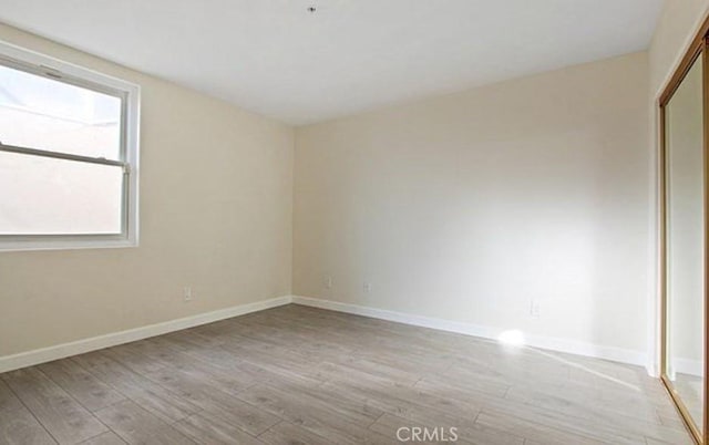 25 15th Pl Unit 101, Long Beach, CA 90802 - spare room featuring light wood finished floors and baseboards