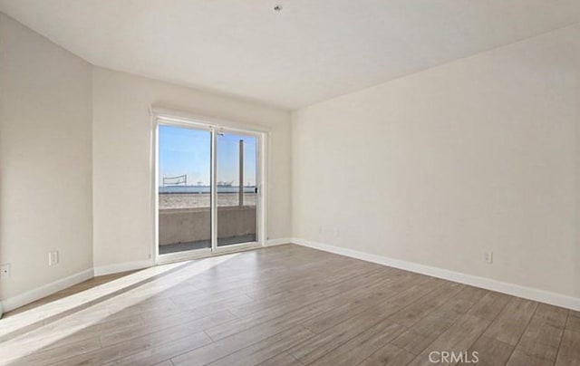 25 15th Pl Unit 101, Long Beach, CA 90802 - unfurnished room featuring wood finished floors and baseboards