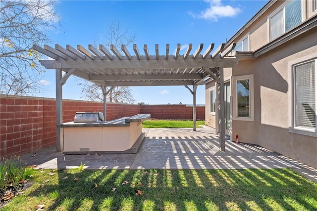 view of patio / terrace with a fenced backyard and a pergola