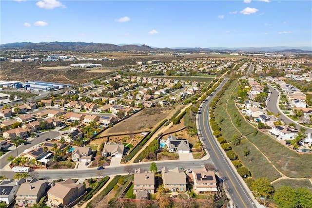 birds eye view of property featuring a mountain view and a residential view