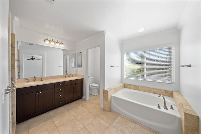 bathroom with crown molding, a sink, toilet, and a bath