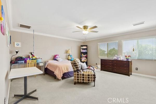 bedroom with visible vents, crown molding, and carpet flooring