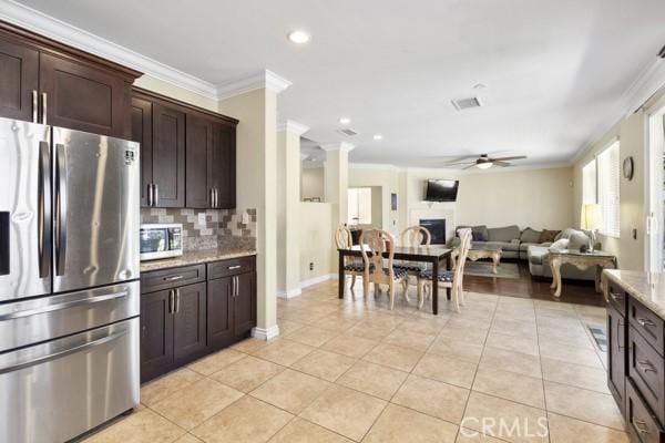 kitchen with stainless steel appliances and crown molding