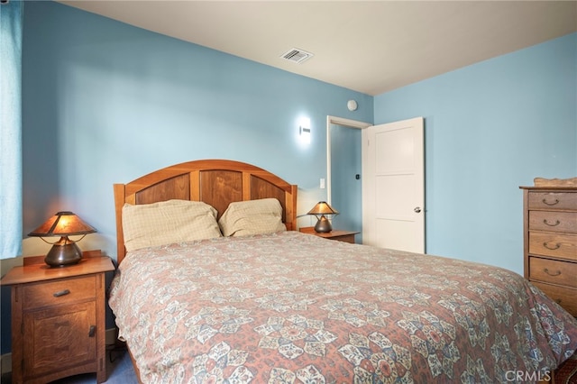 bedroom featuring visible vents