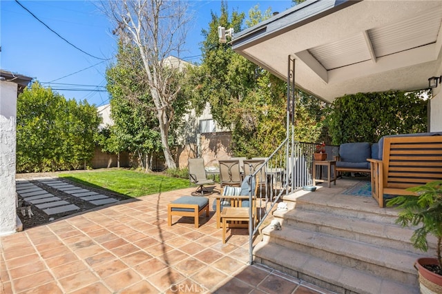 view of patio featuring an outdoor hangout area and a fenced backyard