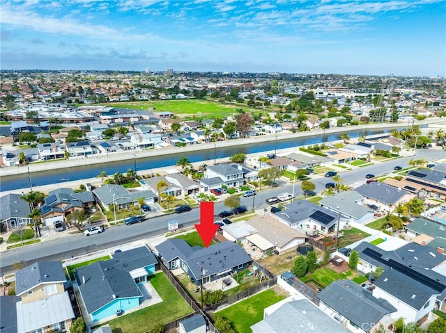 birds eye view of property featuring a residential view and a water view