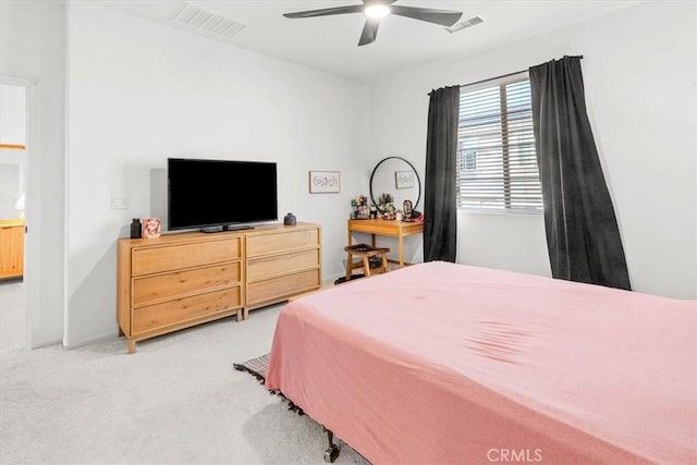 bedroom featuring baseboards, visible vents, ceiling fan, and carpet flooring