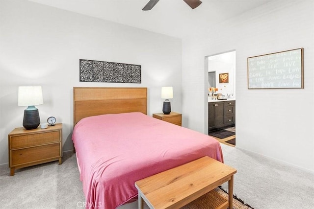 bedroom with carpet floors, a ceiling fan, and ensuite bathroom