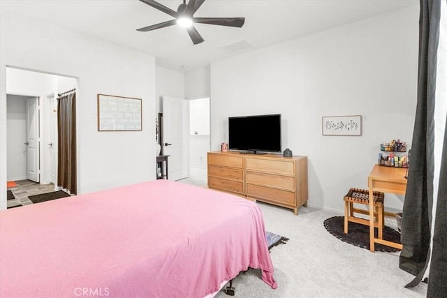 bedroom with baseboards, visible vents, ceiling fan, and light colored carpet