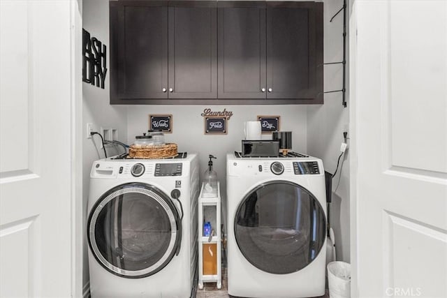 laundry room with washer and dryer and cabinet space