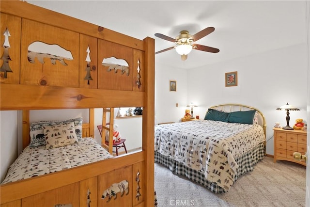 bedroom with a ceiling fan and light colored carpet