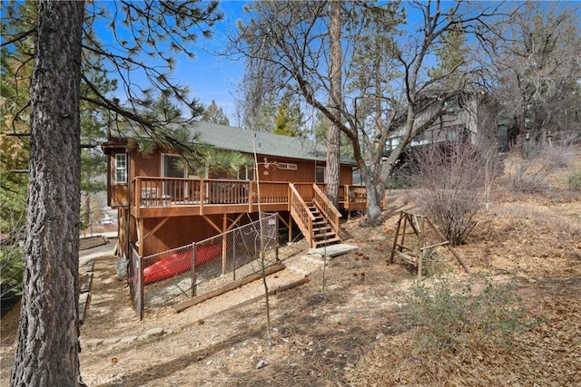 view of jungle gym with stairway and a wooden deck