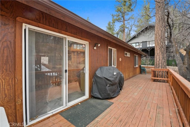 wooden terrace with grilling area