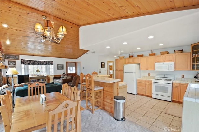 kitchen with tile countertops, light brown cabinetry, white appliances, and light tile patterned floors