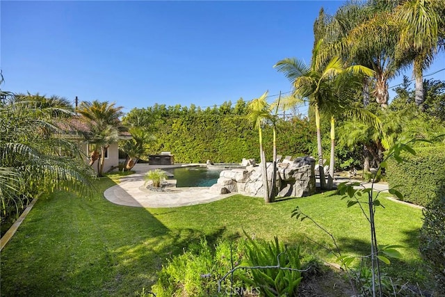 view of yard featuring an outdoor pool and a patio