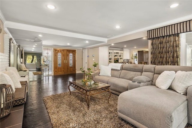 living area with ornamental molding, wood finished floors, and recessed lighting