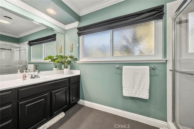 bathroom featuring crown molding, a tile shower, baseboards, and vanity