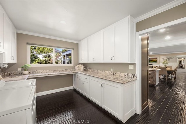 kitchen featuring light stone counters, dark wood-style flooring, crown molding, white cabinets, and built in study area