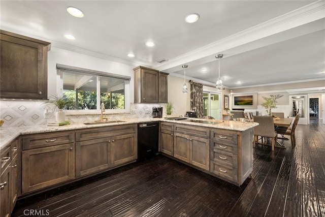 kitchen with tasteful backsplash, dark wood-type flooring, a sink, a peninsula, and black appliances