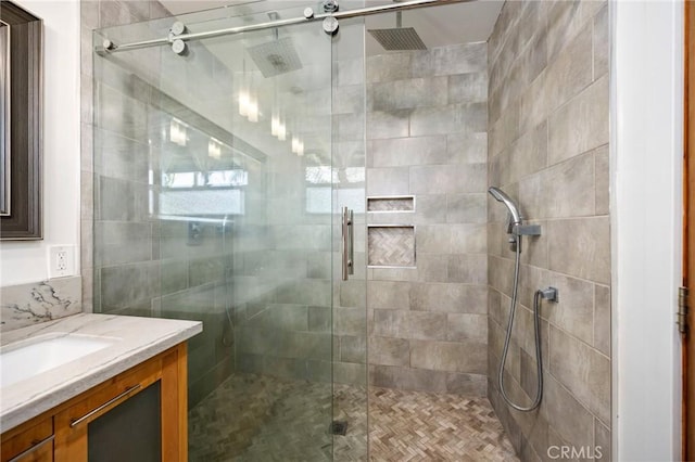 bathroom with vanity and a shower stall