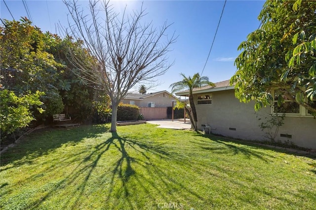 view of yard with a patio and fence