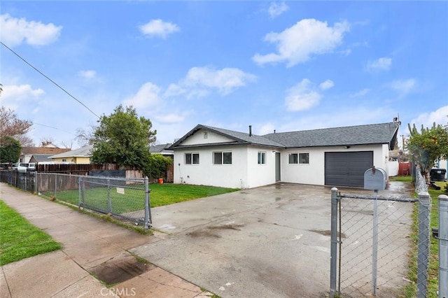 single story home featuring a fenced front yard, stucco siding, a front yard, a garage, and driveway