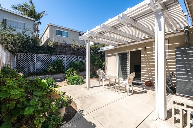 view of patio featuring fence and a pergola