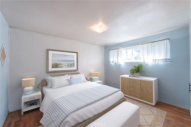 bedroom featuring wood finished floors