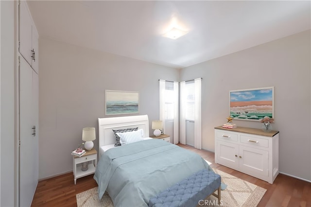 bedroom featuring light wood-style floors