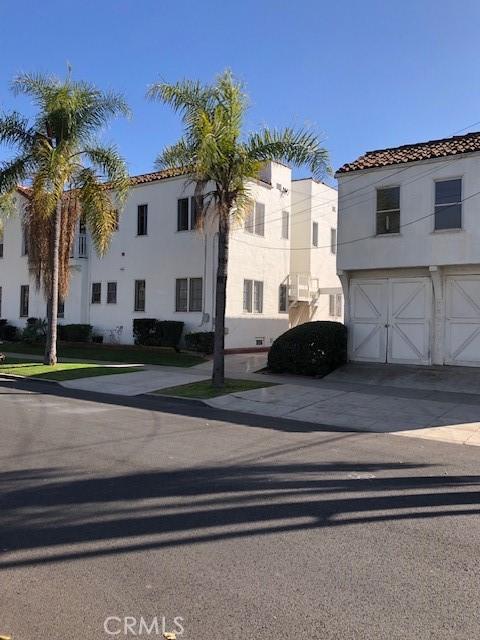 view of front of home featuring an attached garage, concrete driveway, and stucco siding