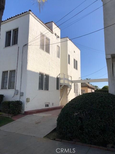 view of side of home with stucco siding