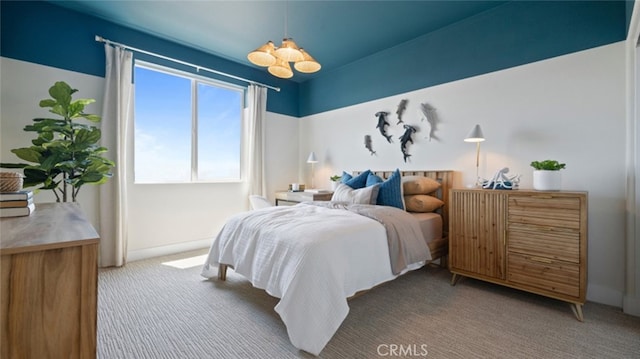 bedroom featuring light colored carpet, baseboards, and an inviting chandelier