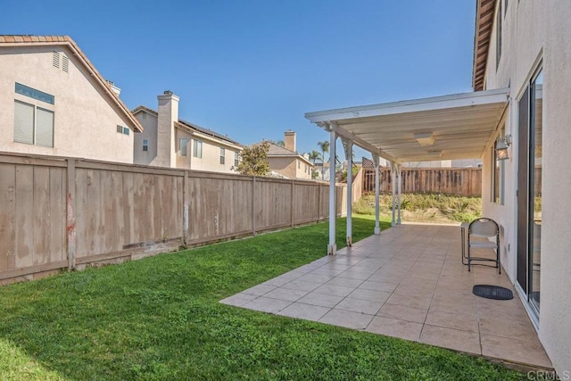 view of yard featuring a patio area and a fenced backyard