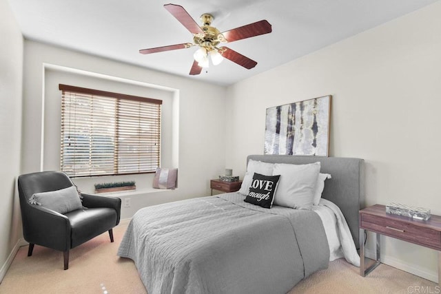 bedroom with ceiling fan and carpet flooring