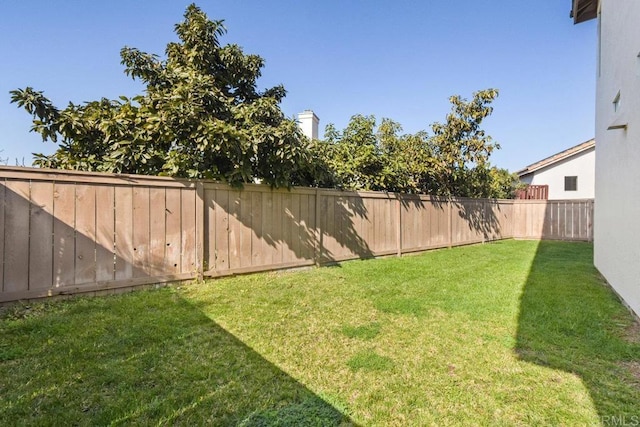 view of yard featuring a fenced backyard