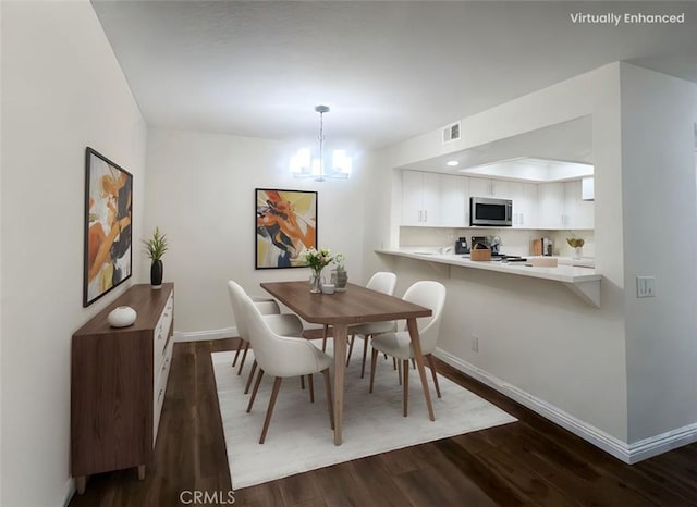 25614 Mont Pointe Unit 3D, Lake Forest, CA 92630 - dining area with dark wood-type flooring and a chandelier