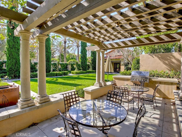 view of patio / terrace with exterior kitchen, outdoor dining area, grilling area, and a pergola