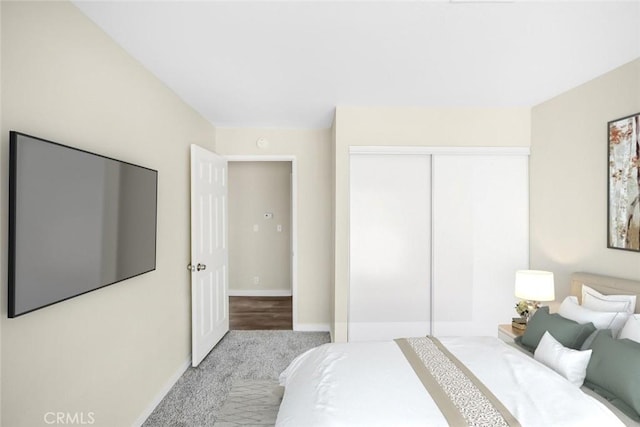 bedroom featuring a closet and baseboards