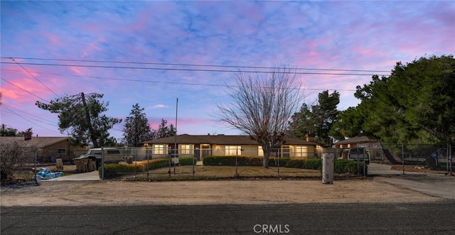 ranch-style home with a fenced front yard