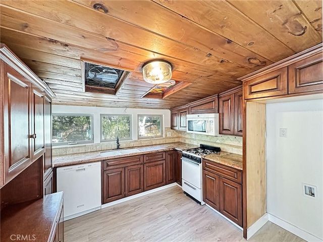 kitchen with wooden ceiling, white appliances, a sink, decorative backsplash, and light wood finished floors