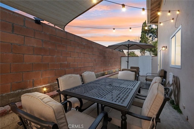 view of patio / terrace featuring outdoor dining space and a fenced backyard