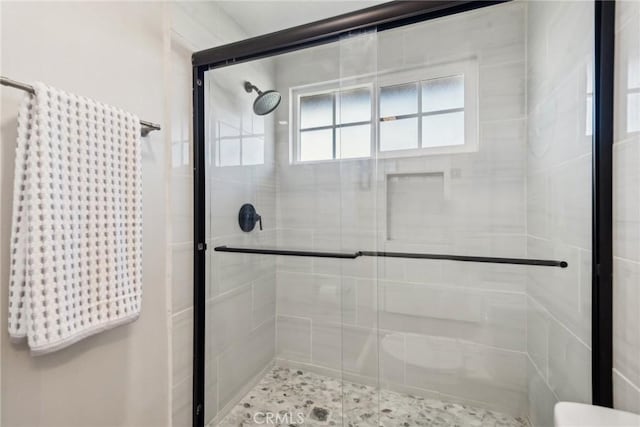 bathroom with a stall shower