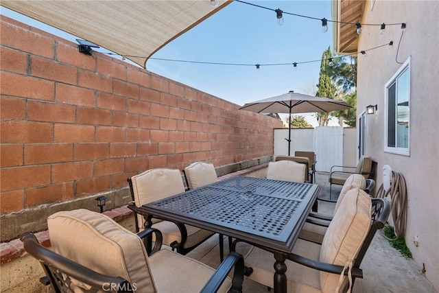 view of patio / terrace featuring a fenced backyard and outdoor dining area