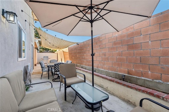 view of patio / terrace featuring a fenced backyard and outdoor dining area