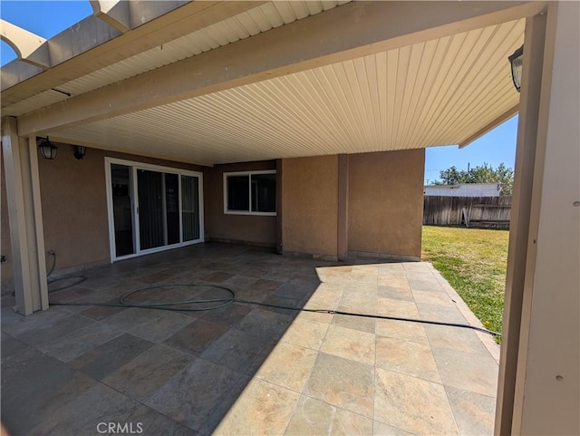 view of patio / terrace featuring fence