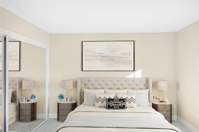 carpeted bedroom featuring baseboards