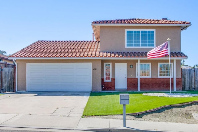 mediterranean / spanish house featuring fence, driveway, an attached garage, and stucco siding