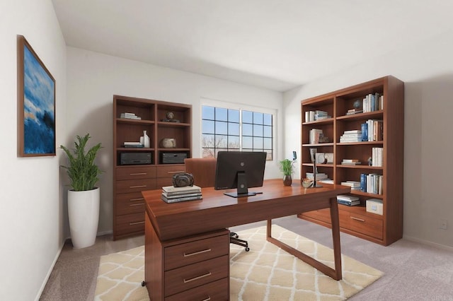 office area featuring light carpet and baseboards